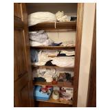 Closet contents including linens, sunbeam