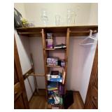 Contents of closet including hurricane candle