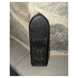 Cast iron fireplace match holder decorated with an