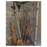 Yard tool lot including shovels, rakes, tree