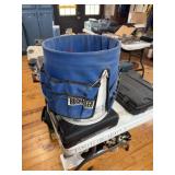 Bucketeer tool carrier with bucket, hammers,
