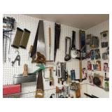 Contents of pegboard - handsaws, work