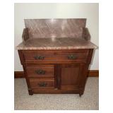 Antique washstand with chocolate marble top