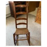 Wooden ladderback rocking chair with woven rush