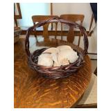 Woven wicker basket with collection of seashells