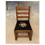 Childs rocker with black needlepoint seat