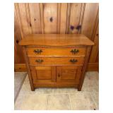 Oak washstand with sepentine front has 2 doors and