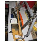 Square, Saw, Yard Stick, & Caulk Gun