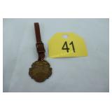 1909 FIREMENS ASSOCIATION FOB