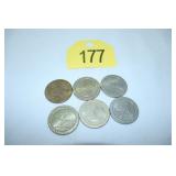six $1 casino gaming tokens