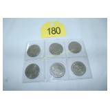 six $1 casino gaming tokens