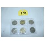six $1 casino dated gaming tokens