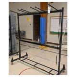 A Modern Chrome Rolling Clothes Rack