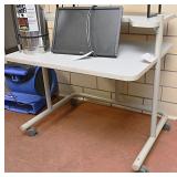 Gray rolling work cart on castors