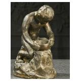 A Terracotta Figure Of A Potter