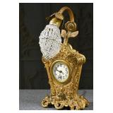 A Gilt Metal Dresser Clock