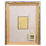 A MCM Framed Perfume Display