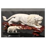 An Oriental Carved Lion and Elephant