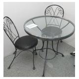 A Wrought Iron Patio Set