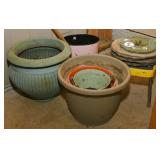Assorted planters and stepping stones