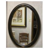 An Early American Style framed mirror