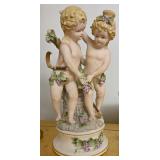 A Bisque Figural Group of Two Bacchanalian Putti