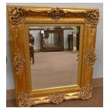A Gilt-Framed Wall Mirror