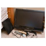 A Toshiba Flat Screen Television With Remote