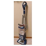 An LiftAway Deluxe Shark Vacuum
