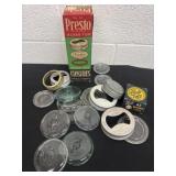 Group of vintage canning lids and glass lids