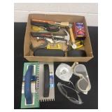 Group of tools trowels googles and more