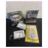 Group of light and tube clamps and atv lights