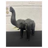 10ï¿½ vintage leather-wrapped elephant figure.