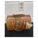 vintage-style, hand-tooled brown leather satchel
