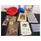 Group of cook books, strainers and containers