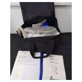 CPAP machine in carrying bag with instructions,