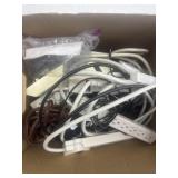 Group of cords, blocks and surge protectors