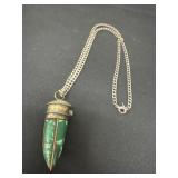 necklace is a Cairo Long Dainty Malachite Tusk
