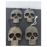 Four 6' metal skulls