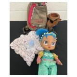 Baby doll, camo bag and camel cup
