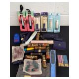 Group of lipstick some is Avon, file and brush