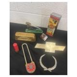 Chevy emblem, stapler, fake gold brick, lock and