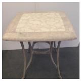 Rock top patio table corner chipped