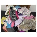 Group of doll and Barbie clothes
