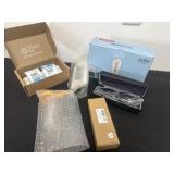 Group of ink refills, light bulbs, sun glasses