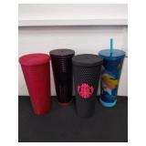 4 Star Bucks and one floral beverage cups