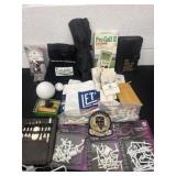 Box of golf supplies and collectibles