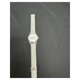 silver-toned wristwatch N&C' logo and a Milanese