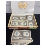 Cigar box full of play money