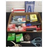 Box of everyday office supplies